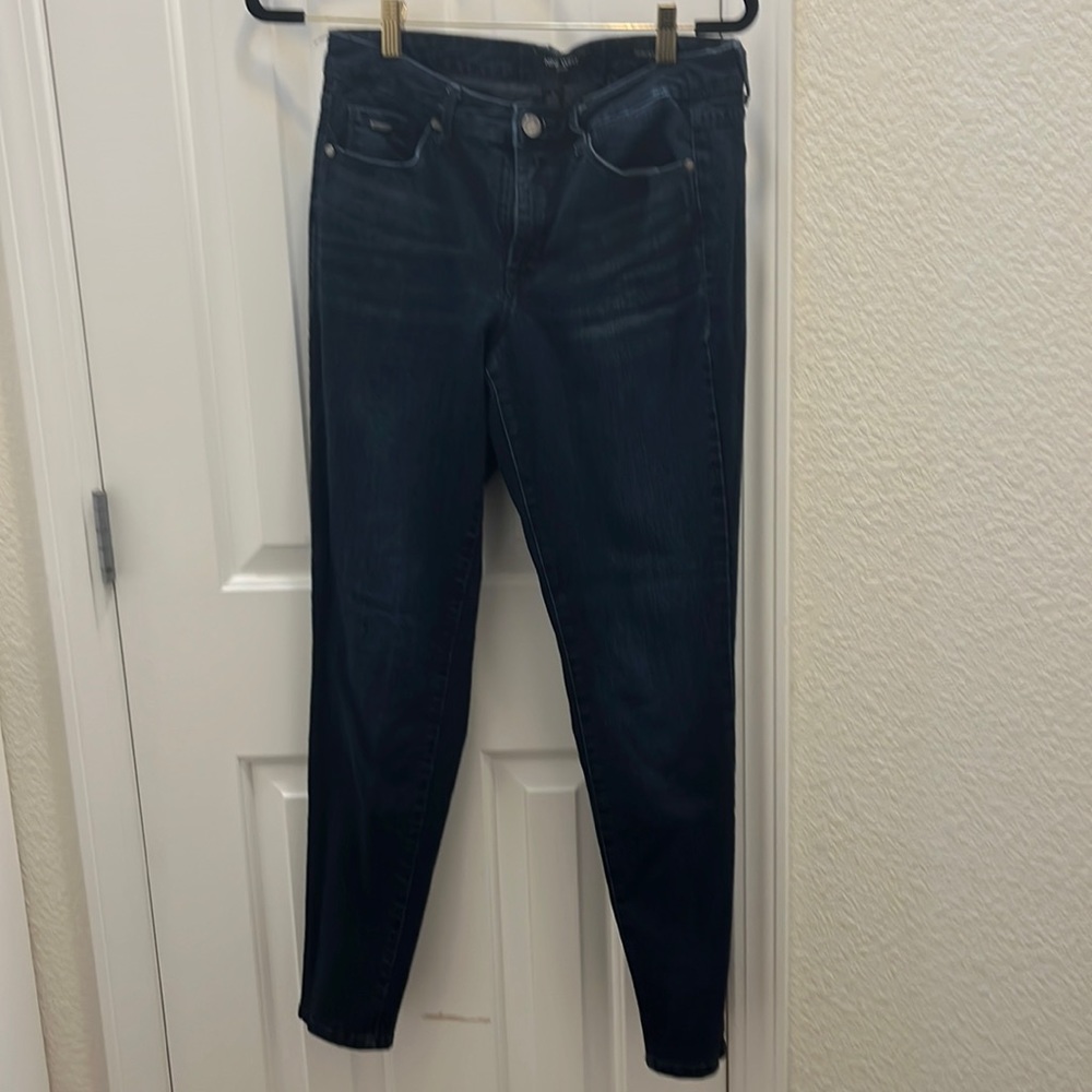 Dark wash skinny leg stretchy mid rise jeans
